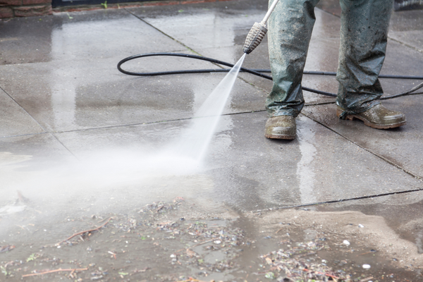 pressure washing a sidewalk