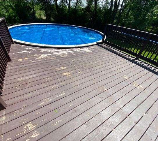 A Close-up of a dirty deck before cleaning